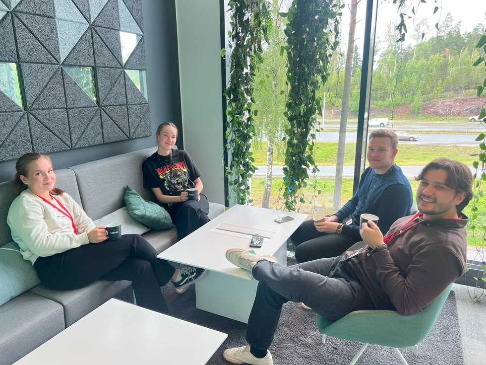 Stefanos enjoying a coffee break with colleagues at the Espoo, Finland office.