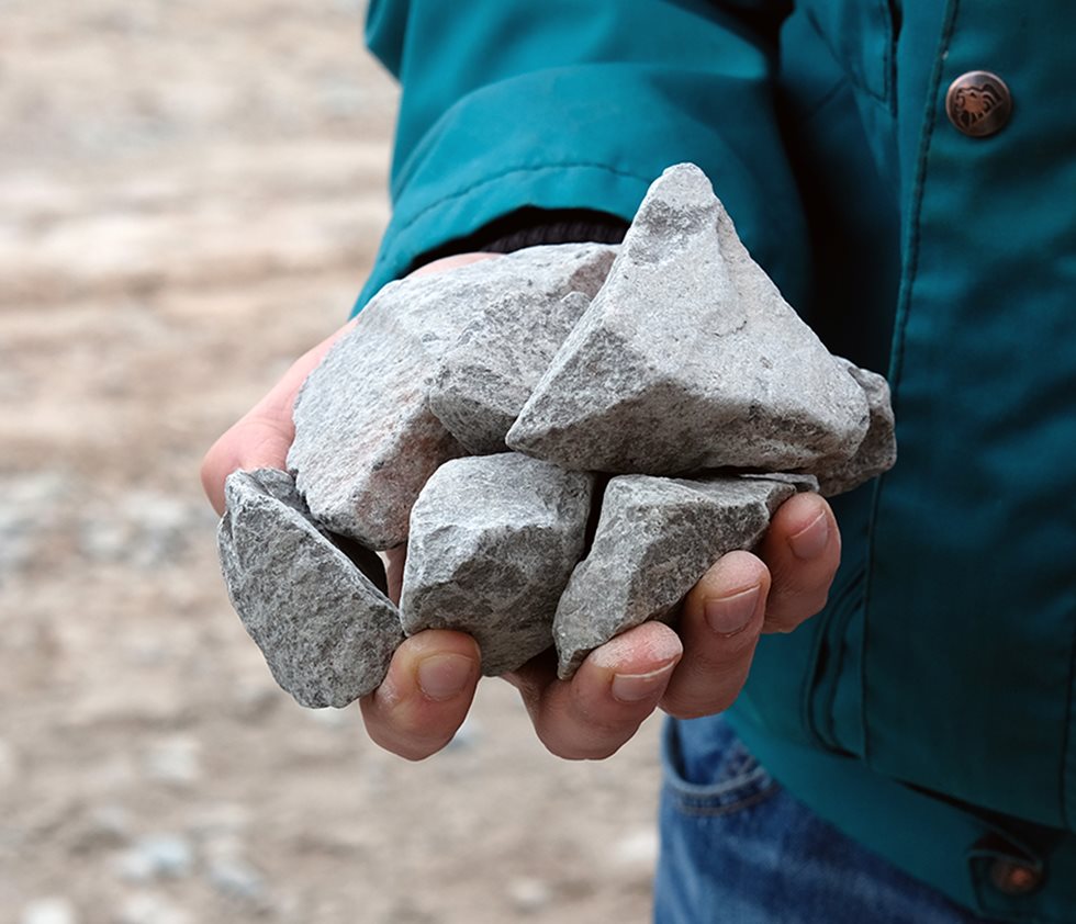 Hand holding aggregates end product at BAG Rammelsbach stone quarry